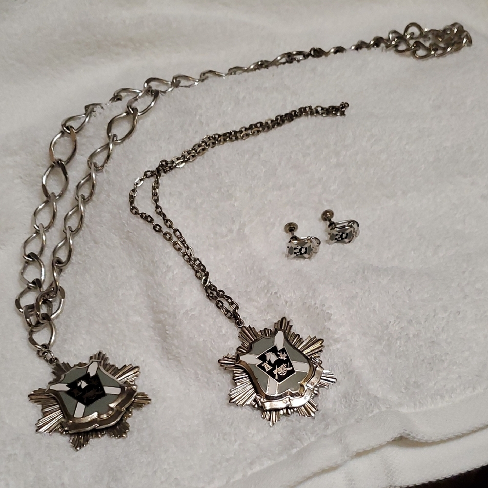 Silver Heraldic Necklace Set with Intricate Designs